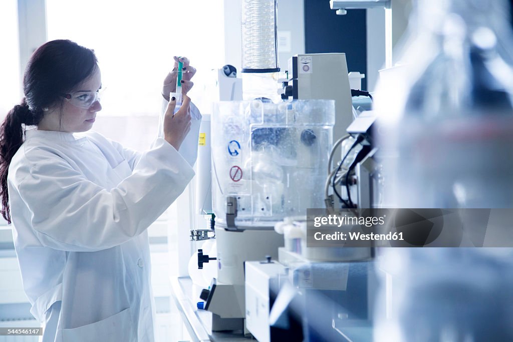 Young female scientist working in a biochemistry labroratory