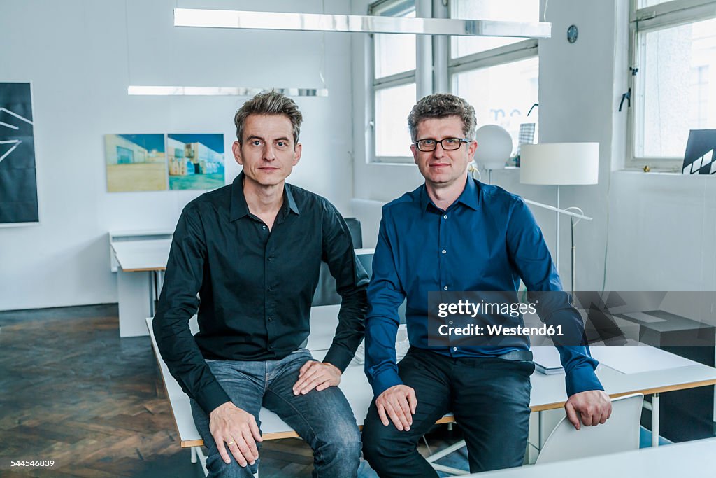 Two designers sitting in their studio