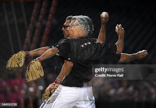 First base coach Dave McKay of the Arizona Diamondbacks throws batting practice prior to a game against the San Francisco Giants at Chase Field on...