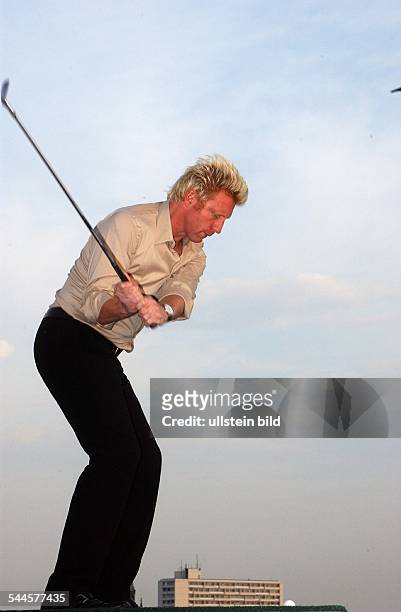 Boris Becker - mit Golfschläger