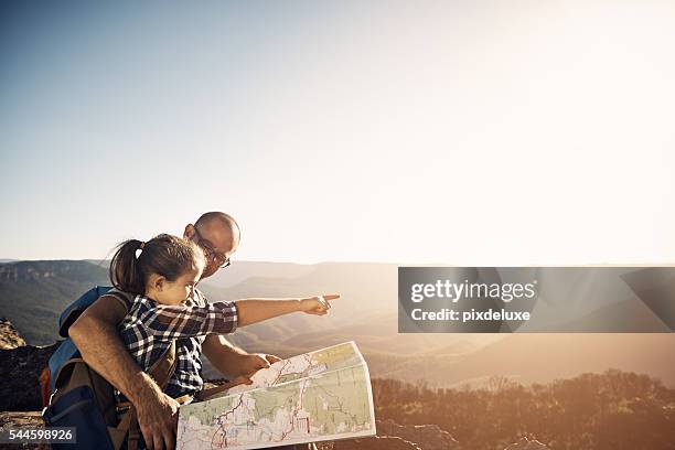 we could use the map or follow the sun - hiking map stock pictures, royalty-free photos & images