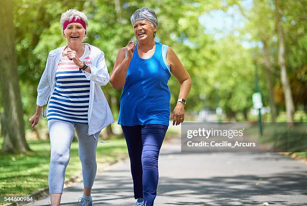 choose your fitness goals and get going - elder lady two stockfoto's en -beelden