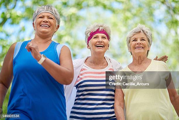 they've made a lifetime commitment to staying fit - 3 old men jogging stockfoto's en -beelden