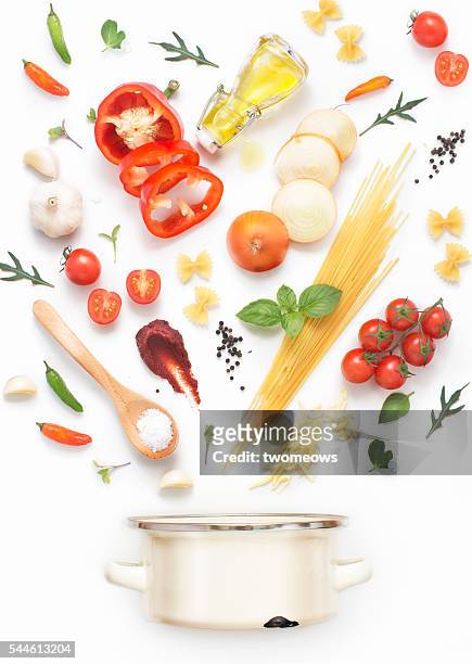 minimalist style flat lay pasta recipe ingredients and cooking pot on white background. - throwing tomatoes stock pictures, royalty-free photos & images