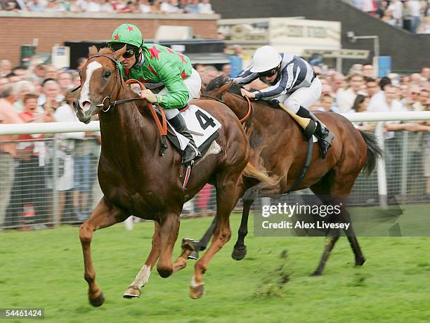 Giganticus ridden by Michael Hills wins The williamhillcasino.com E.B.F Maiden Stakes at Haydock Racecourse on September 3, 2005 in Haydock, England.