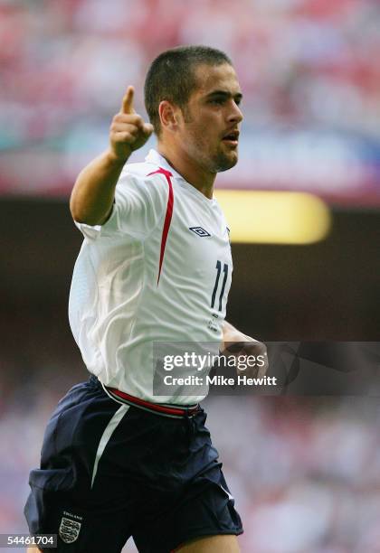 Joe Cole of England celebrates scoring the first goal during the 2006 World Cup Qualifying match between Wales and England at the Millennium Stadium...