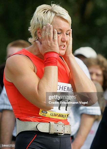 Astrid Kumbernuss of Germany holds her head during the shot put retiring competititon of Astrid Kumbernuss on September 03, 2005 in Berlin, Germany....