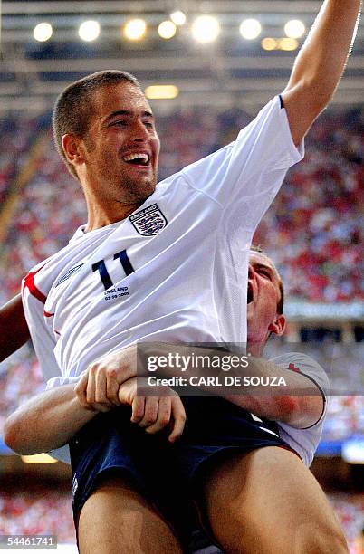 Cardiff, UNITED KINGDOM: England's Joe Cole celebrates his goal during their World Cup qualifying match against Wales at the Millenium stadium,...