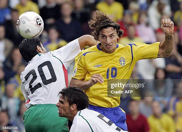 Sweden's Zlatan Ibrahimovic fights for the ball with Bulgarian players Georgi Ivanov and Valentin Iliev during their 2006 World Cup qualifying match...