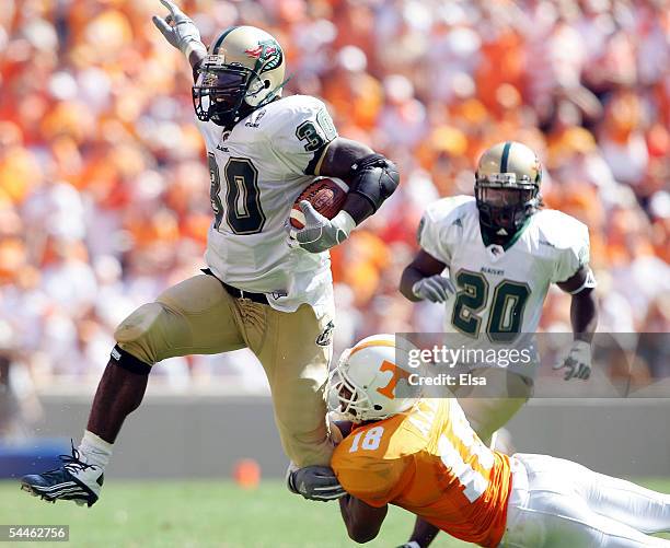 Corey White of UAB is brought down by Jason Allen of Tennessee on September 3, 2005 at Neyland Stadium in Knoxville, Tennessee. The Volunteers...