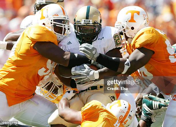 Trey Chaney of the UAB is hitby Turk McBride and Parys Haralson of Tennessee on September 3, 2005 at Neyland Stadium in Knoxville, Tennessee. The...