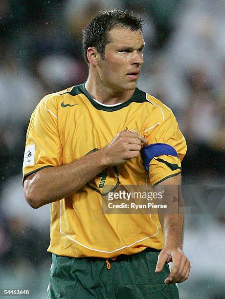 Mark Viduka of Australia tightens his captains armband during the 1st Leg World Cup qualifying match between Australia and the Solomon Islands at...