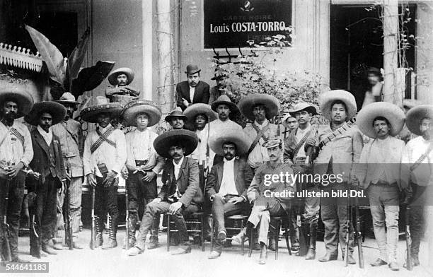 Emiliano ZAPATA . Mexican revolutionary. Zapata, seated center, with his men during the Mexican Revolution , 1914