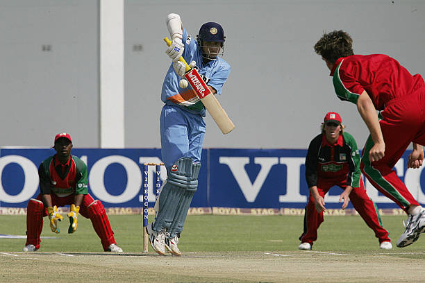Cricket batsman hitting sixes in one over illustrating spread betting volatility on PlayZeet alternative