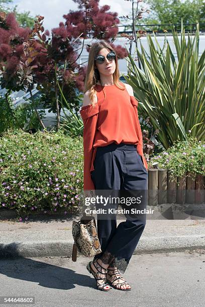Fashion Editor at L"u2019Express Marta Represa wearing a Tibi top and trousers, Sandro bag, Alexandre Birman shoes and Fendi sunglasses on day 4 of...
