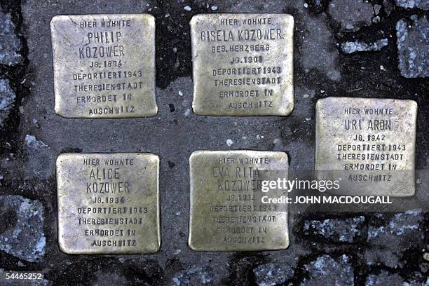 File picture taken on 19 January 2005 shows a cluster of five "stolpersteine" or stumbling stones in Berlin's old Jewish quarter. Gunter Demnig, the...