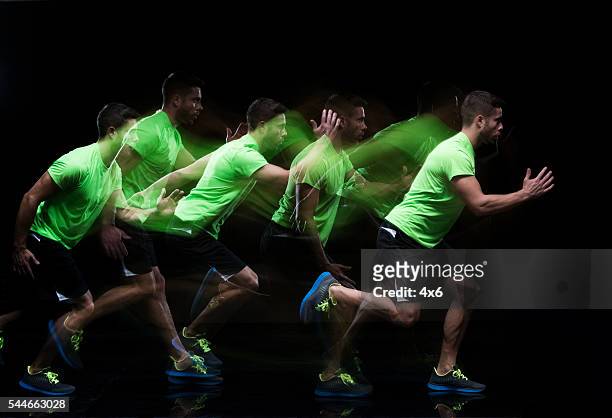 multiple exposure - male runner running - lange sluitertijd stockfoto's en -beelden