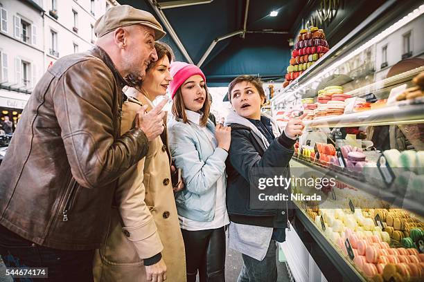 french macarons shopping in paris, france - boulangerie paris stock pictures, royalty-free photos & images