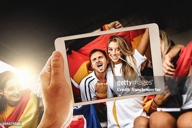 photographing the supporters - stadium screen stock pictures, royalty-free photos & images