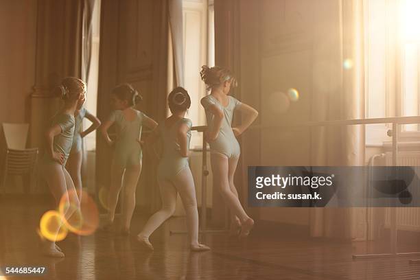 Girls dancing ballet in beautiful sunlight