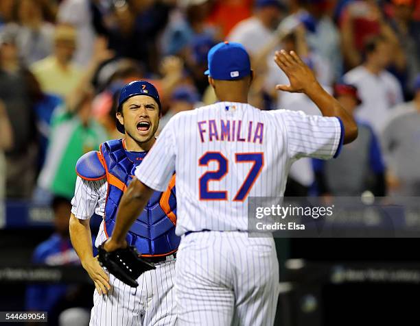 Travis d'Arnaud and Jeurys Familia of the New York Mets celebrate the 4-3 win over the Chicago Cubs at Citi Field on July 2, 2016 in the Flushing...