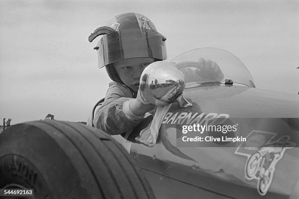 Seven-year-old Thomas Barnard prepares to race in a car built by his father at the Junior Racing Car Club meeting in Maidstone, Kent, 3rd June 1967.