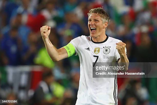Bastian Schweinsteiger of Germany celebrates victory after winning the UEFA EURO 2016 quarter final match between Germany and Italy at Stade Matmut...