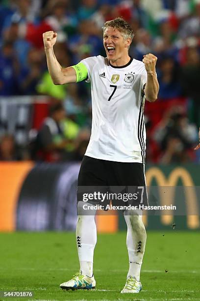 Bastian Schweinsteiger of Germany celebrates victory after winning the UEFA EURO 2016 quarter final match between Germany and Italy at Stade Matmut...