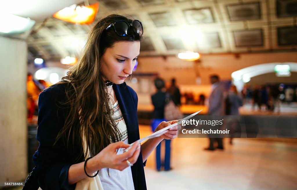 Young tourist woman in Paris metro station