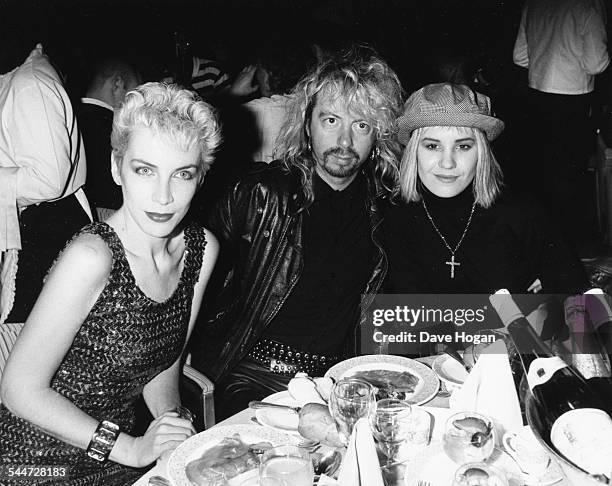 'Eurythmics' musicians Annie Lennnox and Dave Stewart, with his wife Siobhan Fahey of the band 'Bananarama', at the Ivor Novello Music Awards, April...