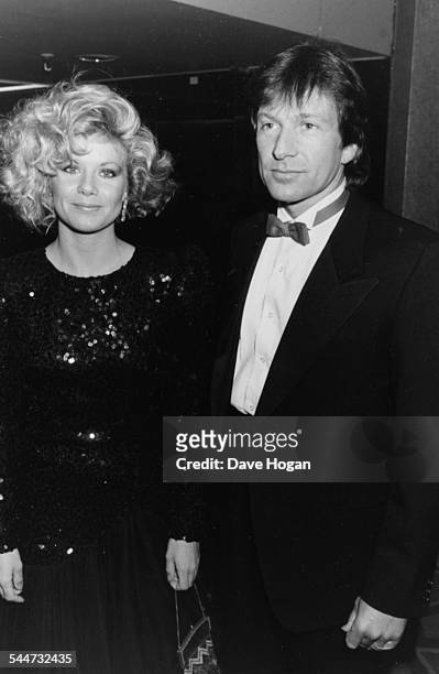 Actors Glynis Barber and Michael Brandon, television's 'Dempsey and Makepeace', attending the British Phonograph Awards, February 10th 1986.