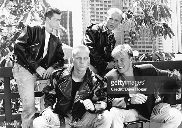 Portrait of singer Jason Donovan with British boy band 'Bros', Craig Logan, Matt Goss and Luke Goss, in Australia, November 1st 1988.