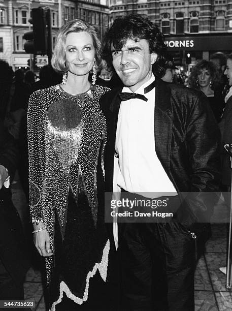 Musician Dave Clark and his wife attending the premiere of his musical 'Time' in London, April 10th 1986.