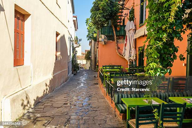 plaka neighborhood in athens, greece - plaka greek cafe stock pictures, royalty-free photos & images