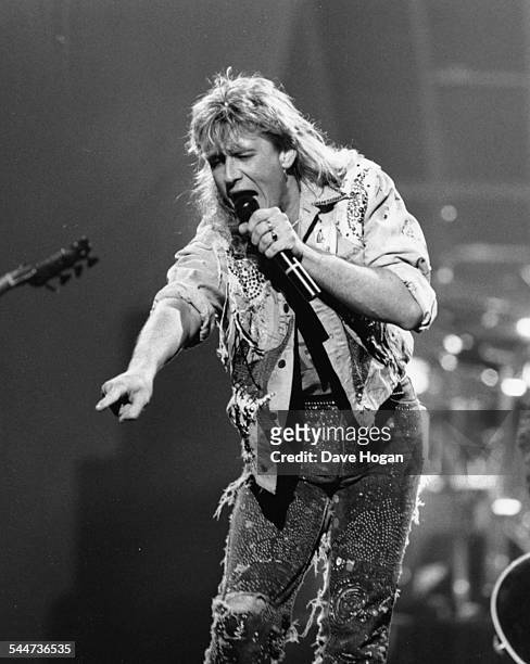 Joe Elliot, lead singer with the band 'Def Leppard', performing on stage at the BRIT Awards, London, February 15th 1989.