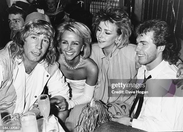 Musician Rick Parfitt and actors Debbie Ash, Leslie Ash and Chris Quinten, celebrating the new year in London, January 2nd 1985.