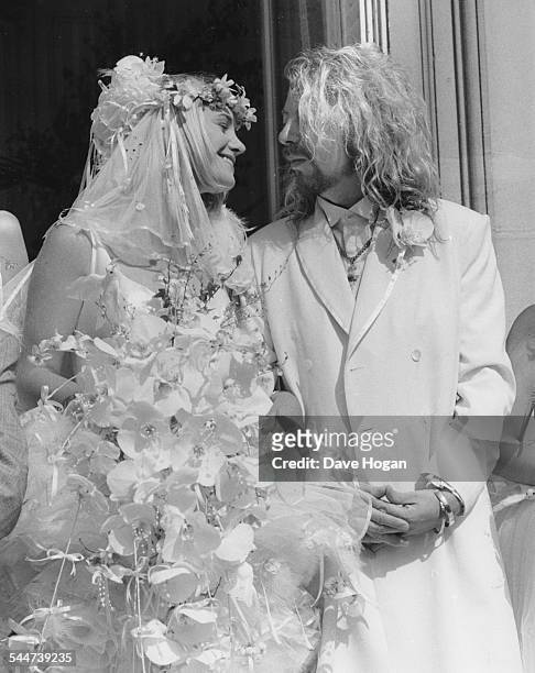Musician Dave Stewart and his new bride Siobhan Fahey, of the band 'Bananarama', outside the church on their wedding day, August 1st 1987.