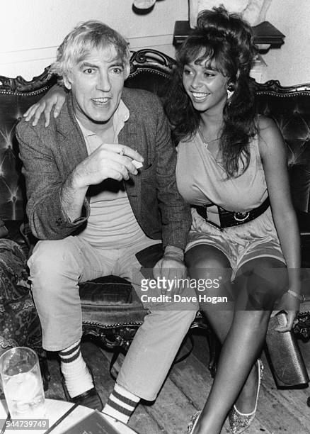 Actor Peter Cook and model Maria Whittaker at the Hippodrome, London, July 7th 1987.