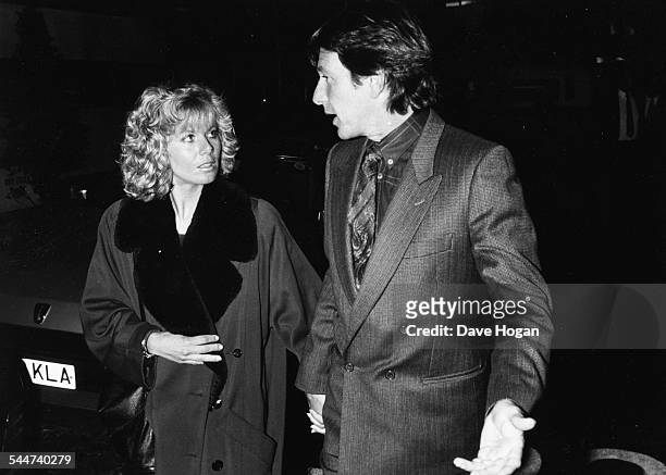 Actors Glynis Barber and Michael Brandon, stars of the television show 'Dempsey and Makepeace', arriving to see the musical 'Drood' in London, 1987.