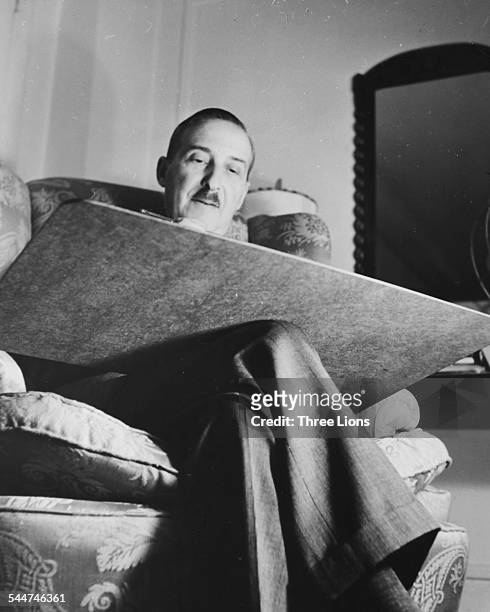 Austrian novelist Stefan Zweig working on his manuscripts, circa 1930.