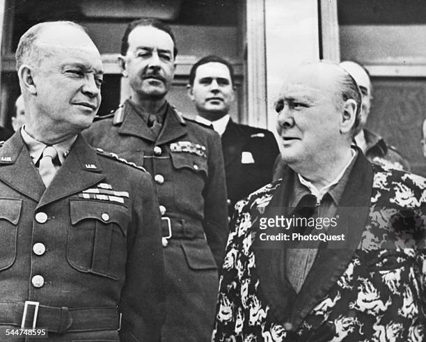 View of American military commander, and later US President, General Dwight D Eisenhower and British Prime Minister Sir Winston Churchill , dressed...