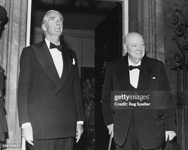 Former British Prime Minister's Sir Anthony Eden and Sir Winston Churchill attending a dinner party in honor of President Eisenhower, at 10 Downing...