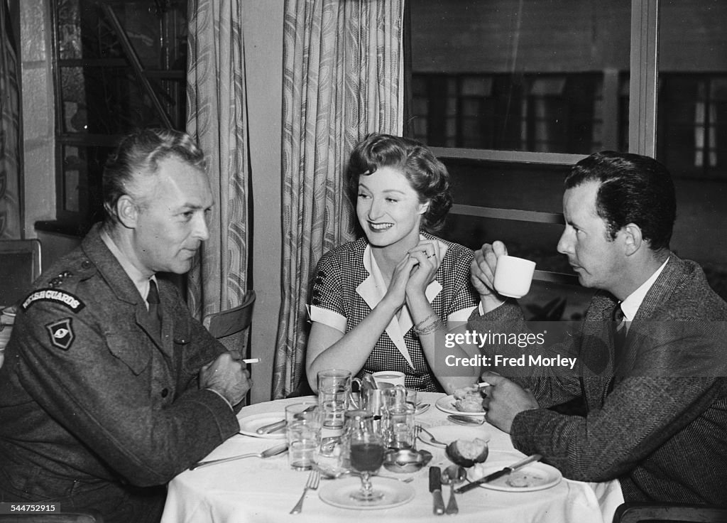 Terence Ralf Film director Terence Young talking to actors Ralph Clanton and Helen ...