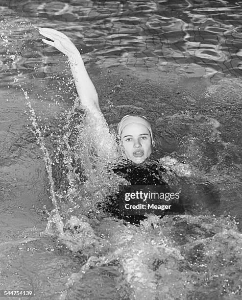 Swimmer Margaret Edwards practicing her record breaking back stroke at Heston Baths, in preparation for the London versus Berlin swimming gala,...