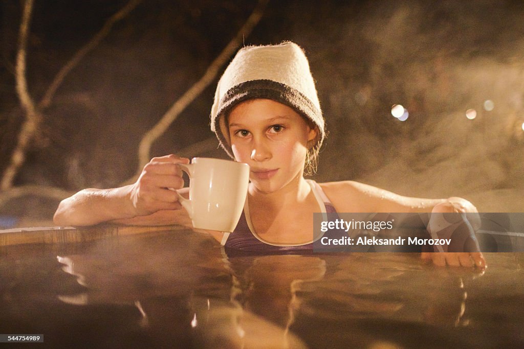 Girl sitting in a Japanese bath Ofuro