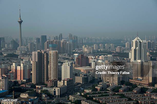 Overview of a Tianjin business district. Tianjin, with a total population of 15 000, is the 4th largest city in China, after Shanghai, Beijing and...