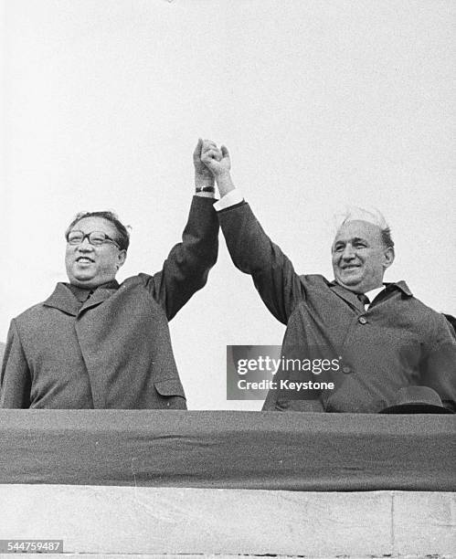 North Korean President Kim Il Sung and his Bulgarian counterpart Todor Zhivkov triumphantly holding their hands in the air at at rally in Sofia,...