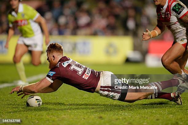Nathan Green of the Sea Eagles scores a try during the round 17 NRL match between the Manly Sea Eagles and the St George Illawarra Dragons at...