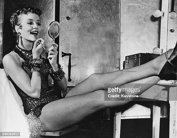 Portrait of actress Patrice Wymore applying make-up as she sit in from of her dressing room mirror, behind the scenes in Hollywood, CA, August 26th...