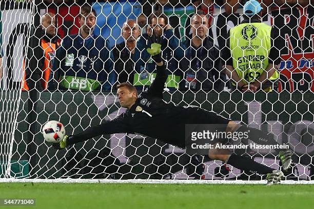 Manuel Neuer of Germany makes a safe during the penalty shootout of the UEFA EURO 2016 quarter final match between Germany and Italy at Stade Matmut...
